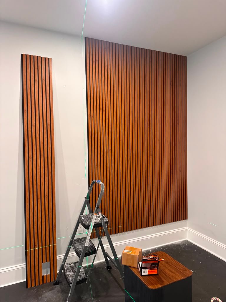 Acoustic wall panels installation in progress