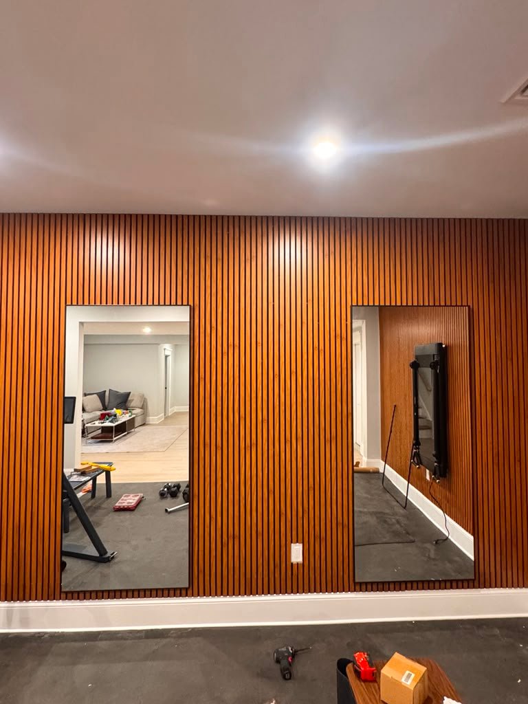 Acoustic wall panels with mounted mirrors