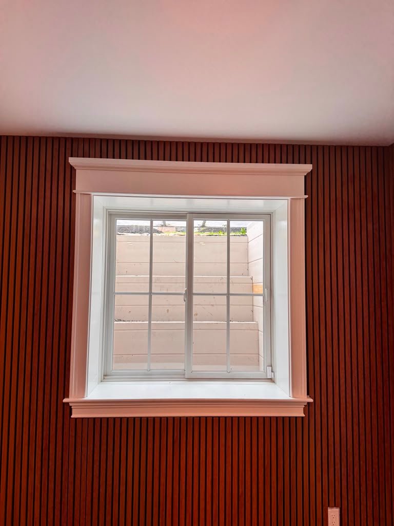 Acoustic wall panels around window trim