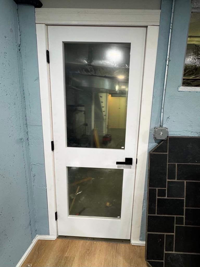 Glass panel basement door installation
