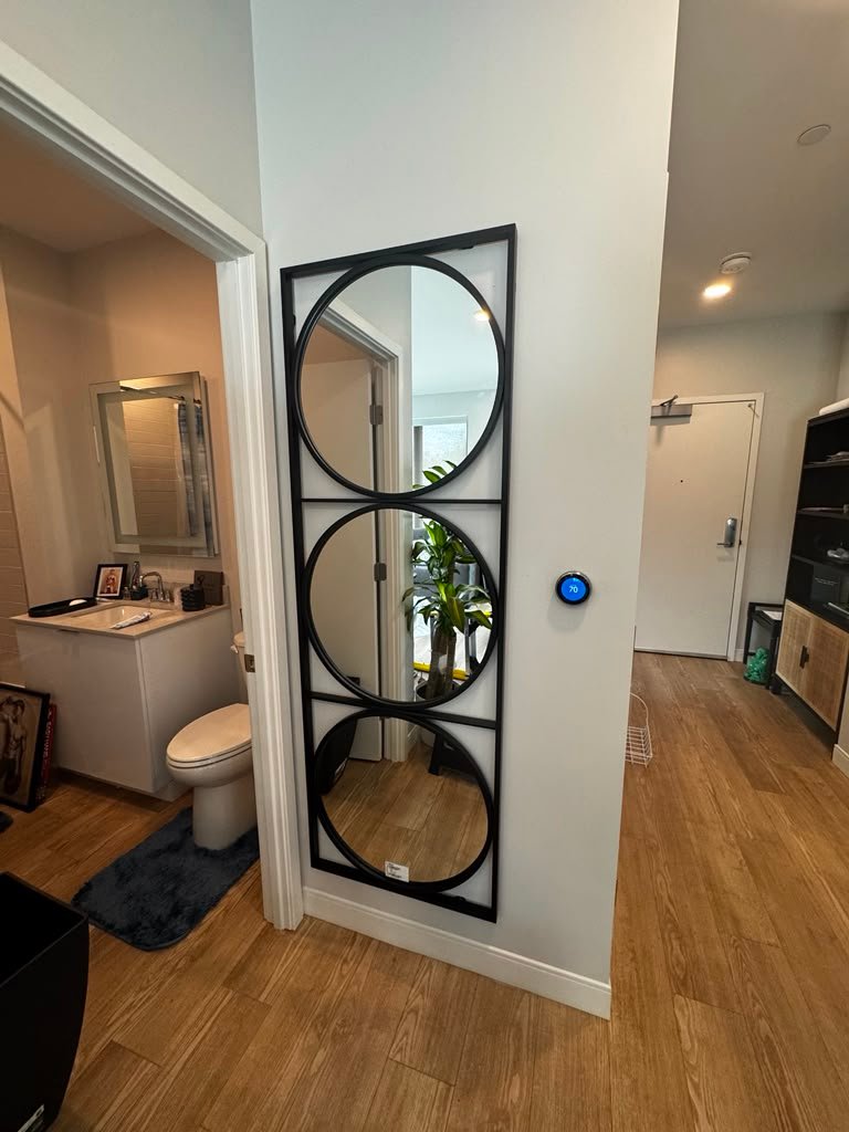Tall three-circle mirror installation
