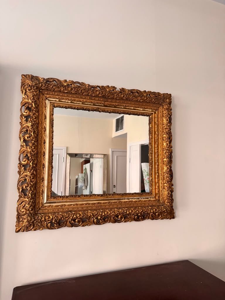 Gold ornate mirror installation