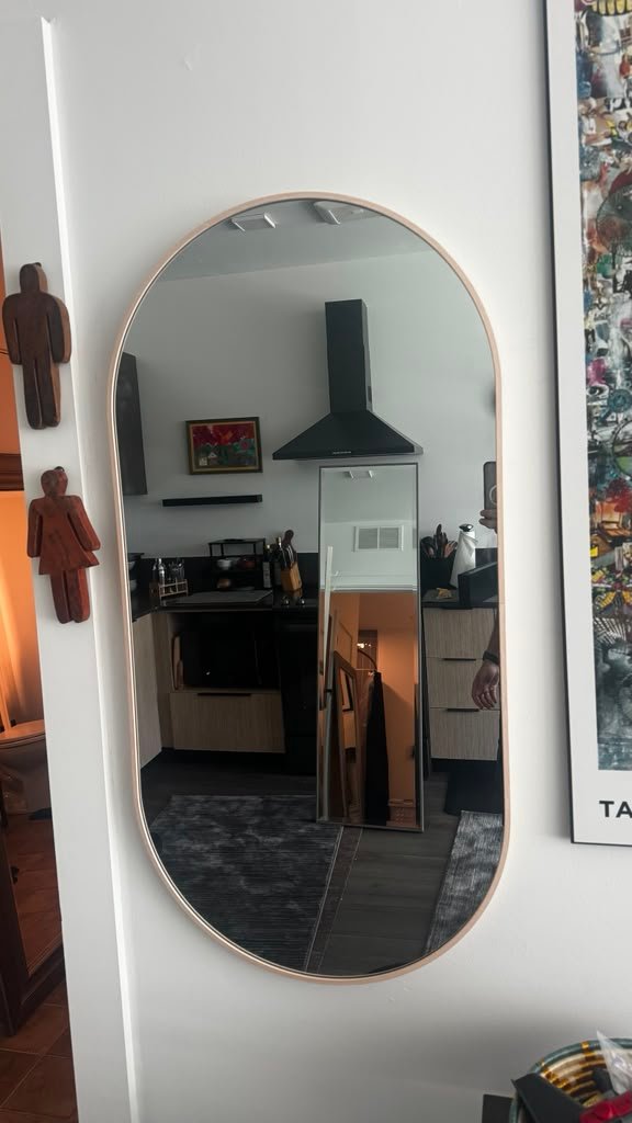 Oval wall mirror installation