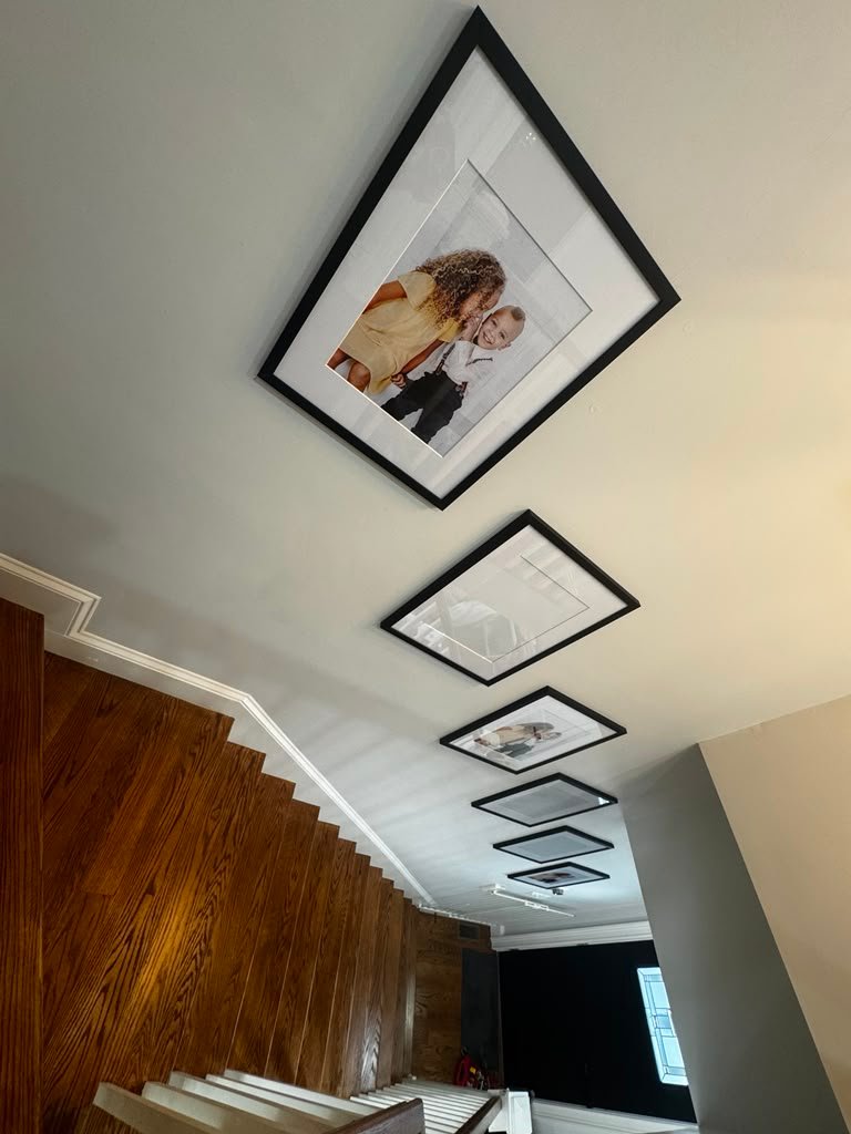Stairway picture hanging alignment