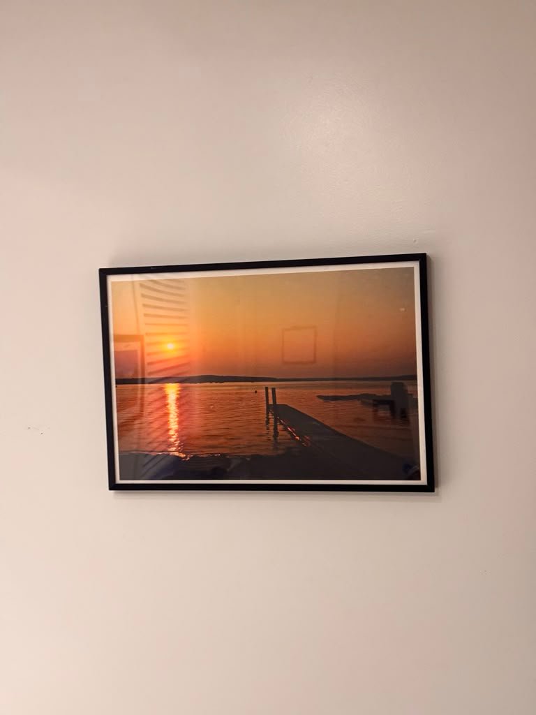 Framed sunset picture hanging