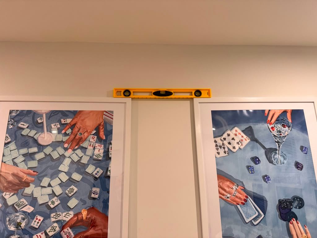 Leveling framed pictures for hanging