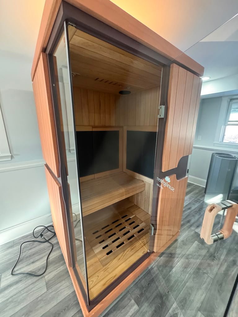 Glass front sauna assembly