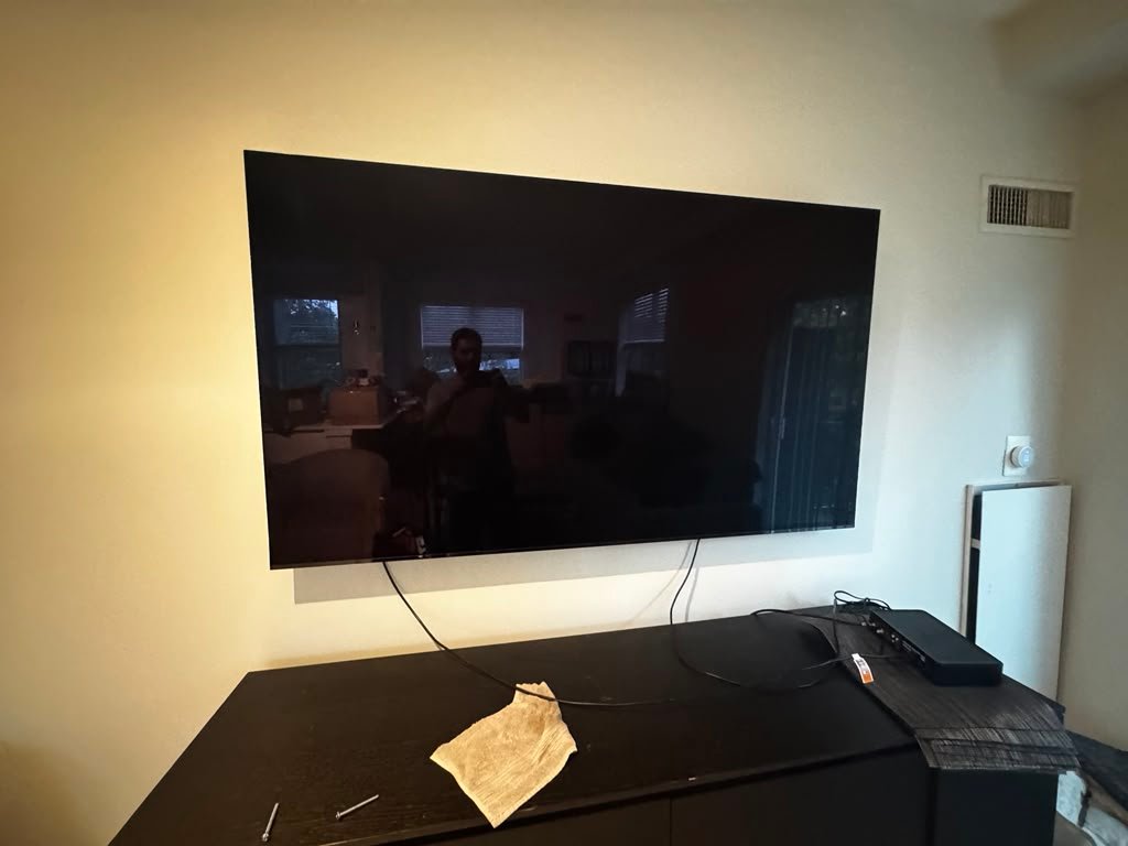 Large TV mounting over cabinet
