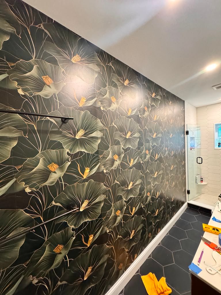 Dark floral bathroom wallpaper installation close view