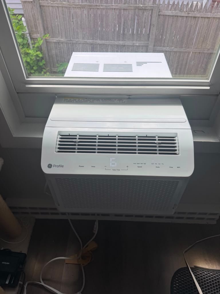Window AC installation above radiator